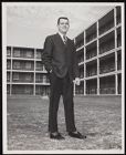 Photograph of student Jim Chesnutt in front of his dorm